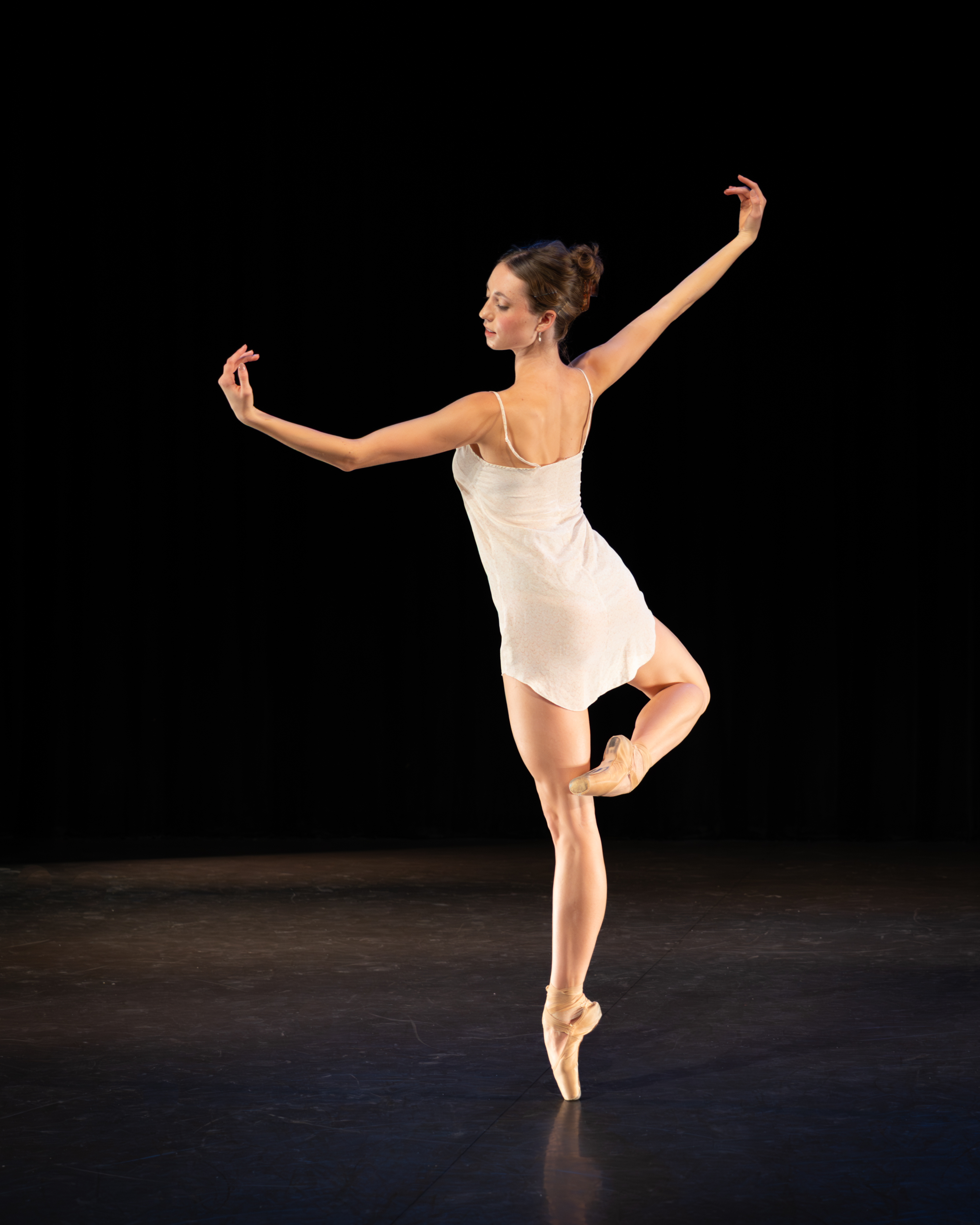 ballet dancer with arms outstretched