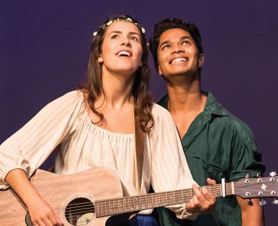 Pair of actors with guitar